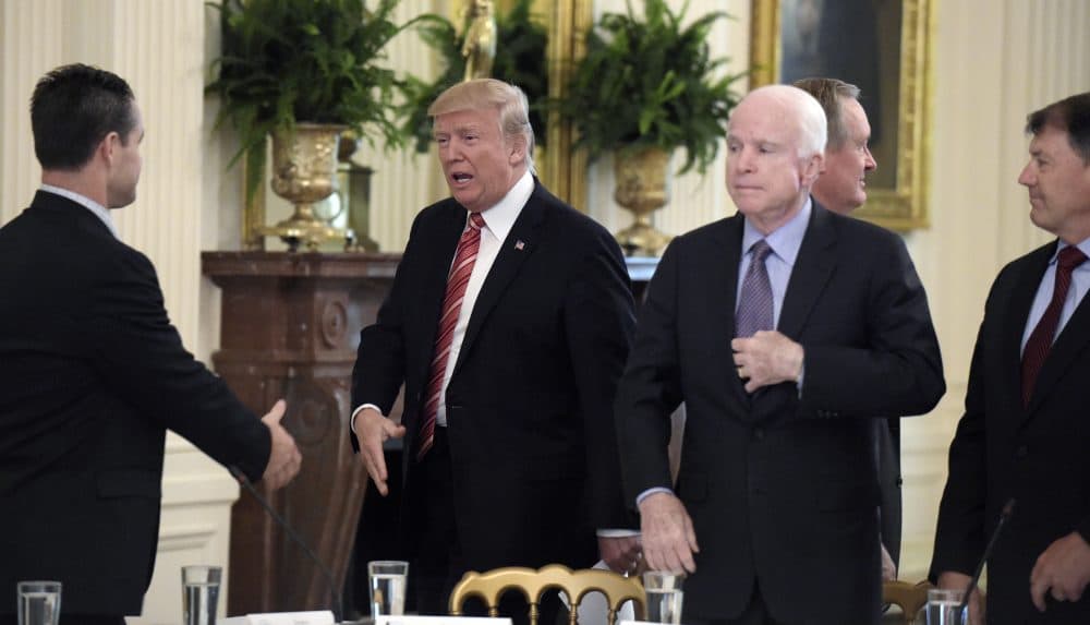 Sen John McCain, R-Ariz., watches as President Trump arrives for a meeting with Republican senators on health care in Washington, D.C. Tuesday, June 27, 2017. (Susan Walsh/AP)