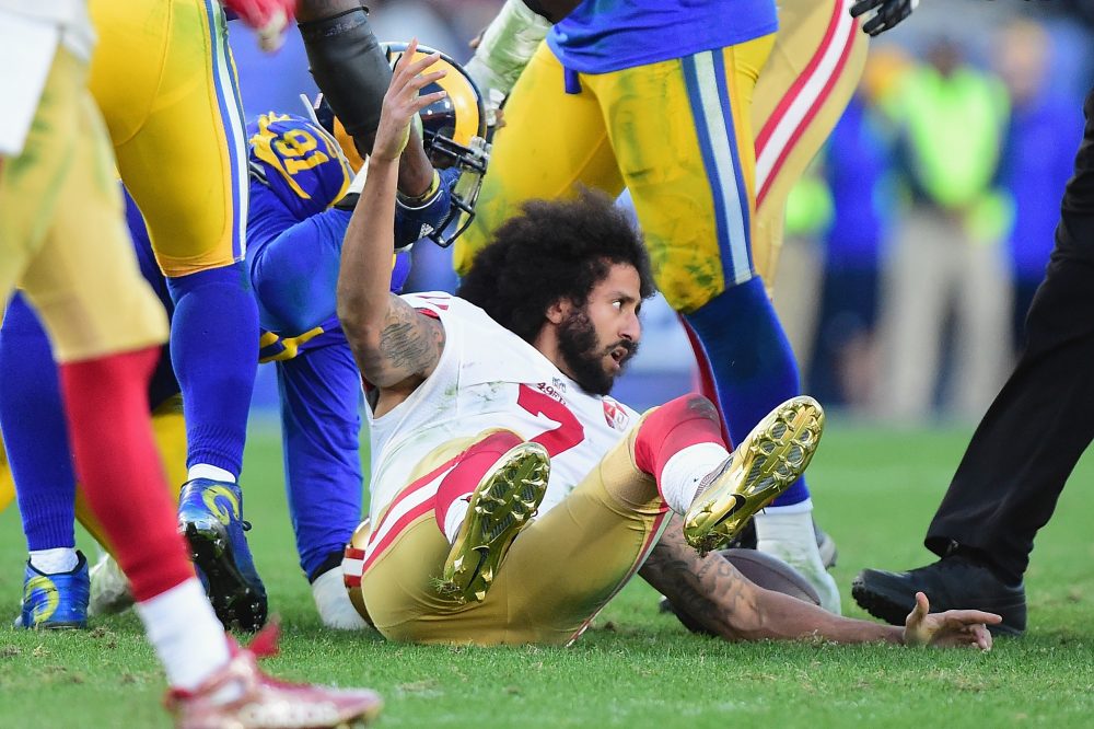 Colin Kaepernick of the San Francisco 49ers reacts after being tackled during the game against the Los Angeles Rams at Los Angeles Memorial Coliseum on December 24, 2016 in Los Angeles, Calif. (Harry How/Getty Images)