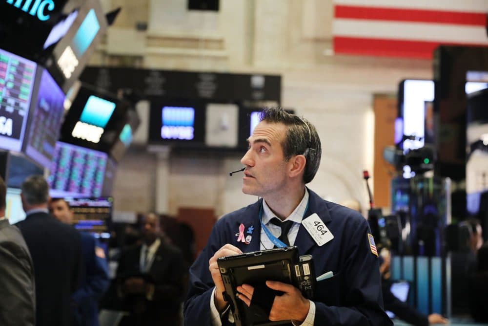 Traders work on the floor of the New York stock Exchange (NYSE) on July 26, 2017 in New York City. The Dow Jones industrial average rose over 90 points as Boeing and other companies posted strong earnings and the Federal Reserve has decided to leave rates unchanged. (Spencer Platt/Getty Images)