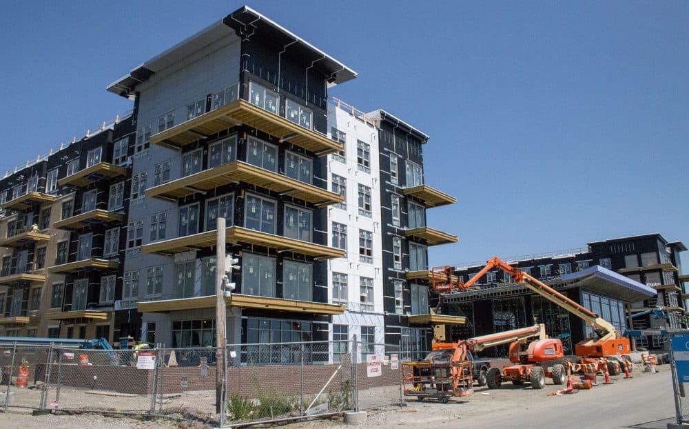 A new housing development being built on Lewis Street along the Boston Harbor. (Kathleen Dubos for WBUR)