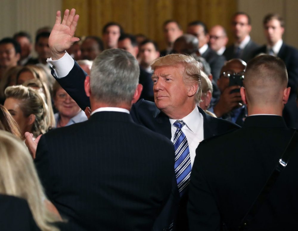 U.S. President Donald Trump waves to the crowd while attending a small businesses event in the East Room at the White House on Aug. 1, 2017 in Washington. (Mark Wilson/Getty Images)