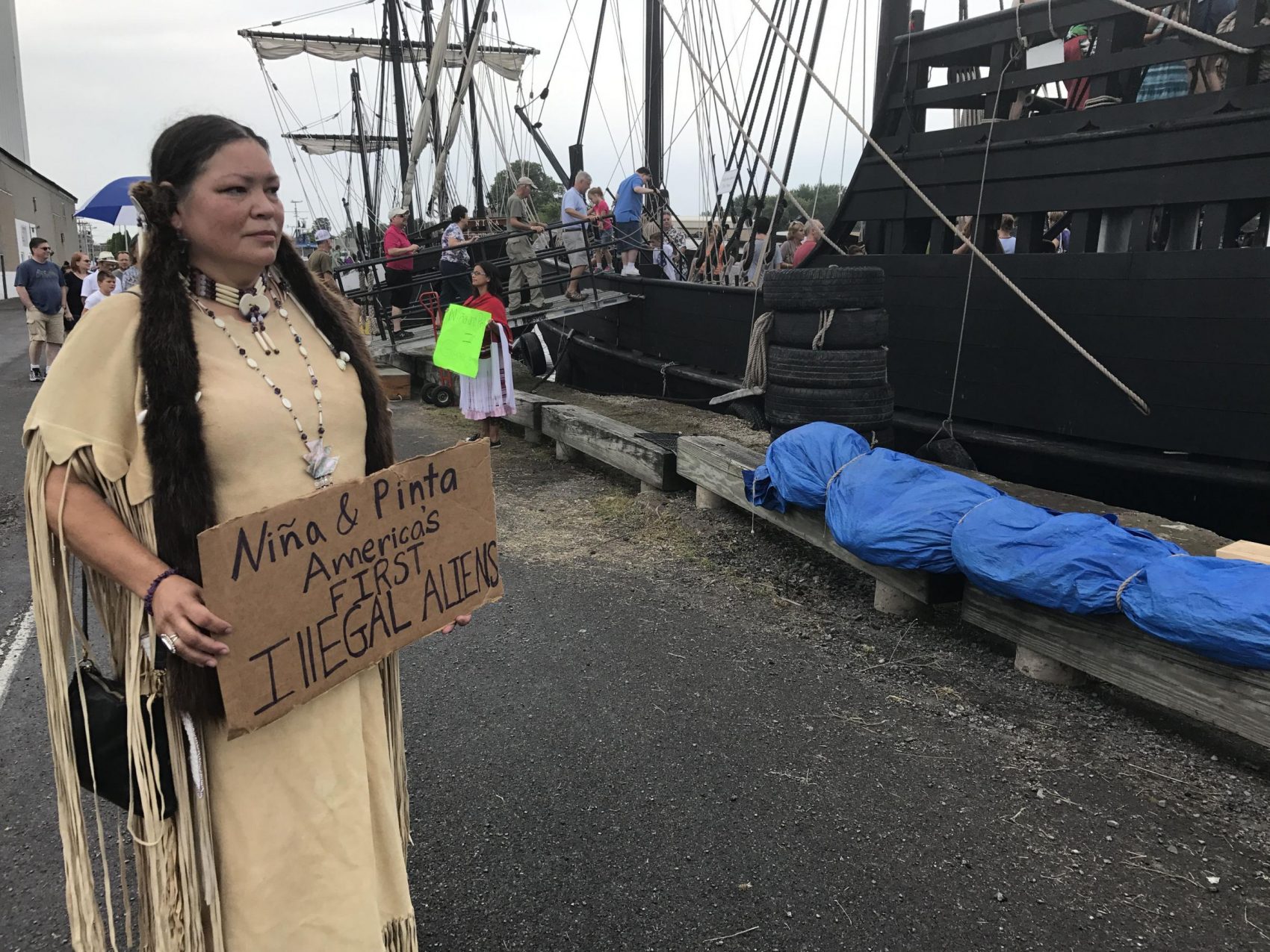 Renee Roman Ose, a descendent of the Oklahoma Cheyenne, came to the Oswego Harbor Saturday to protest the two Christopher Columbus ships and educate people on about the genocide and terror it brought to the original inhabitants of the Americas. (Payne Horning/WRVO)