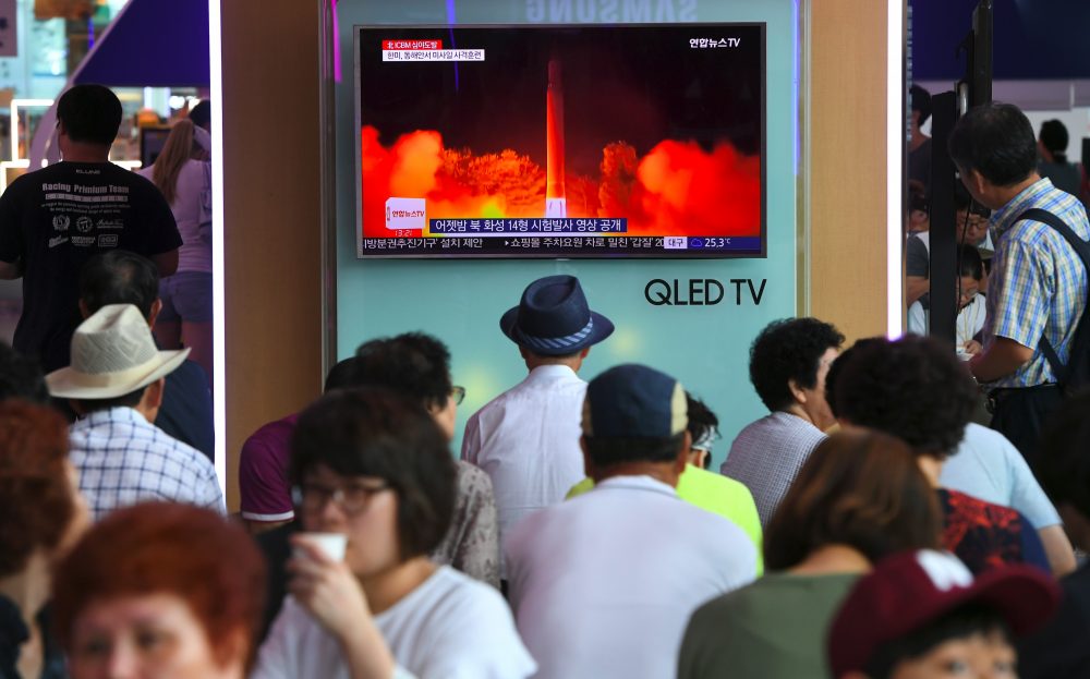 People watch a television screen showing a video footage of North Korea's latest test launch of an intercontinental ballistic missile, at a railway station in Seoul on July 29, 2017. (Jung Yeon-Je/AFP/Getty Images)
