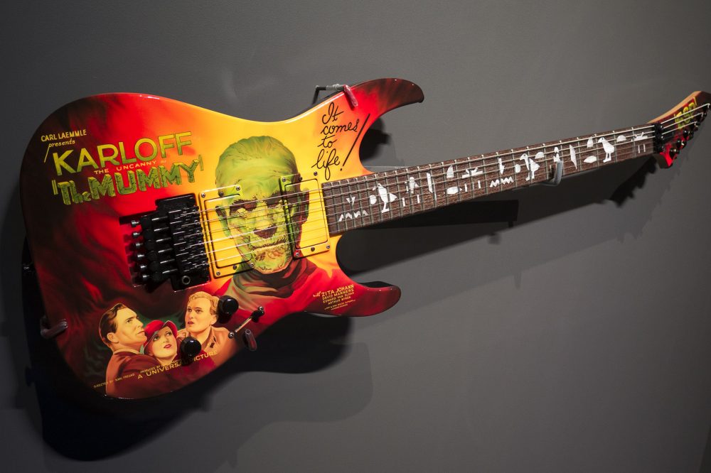 Metallica guitarist Kirk Hammett's guitar with imprint from &quot;The Mummy&quot; posters (and hieroglyphics on the neck. (Andrea Shea/WBUR)