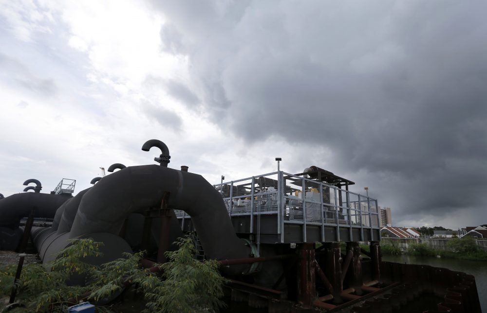 Rain clouds gather over the 17th Street Canal pumping station in New Orleans, Thursday, Aug. 10, 2017. With more rain in the forecast and city water pumps malfunctioning after weekend floods, New Orleans' mayor is urging residents of some waterlogged neighborhoods to move their vehicles to higher ground. (Gerald Herbert/AP)