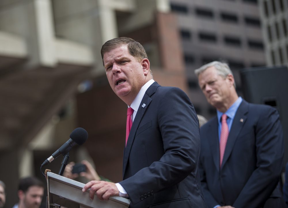 Boston Mayor Marty Walsh speaks at a news conference Monday about a planned free speech rally Saturday. Gov. Charlie Baker looks on. (Jesse Costa/WBUR)