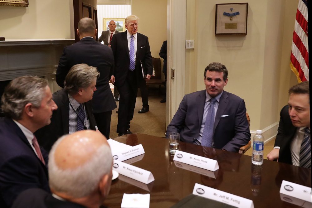 President Trump walks into the Roosevelt Room for a meeting with Mark Sutton of International Paper, Jeff Fettig of Whirlpool, White House Senior Counselor Steve Bannon, Kevin Plank of Under Armour, Elon Musk of SpaceX (left) and other other business leaders at the White House on Jan. 23, 2017 in Washington, D.C. (Chip Somodevilla/Getty Images)