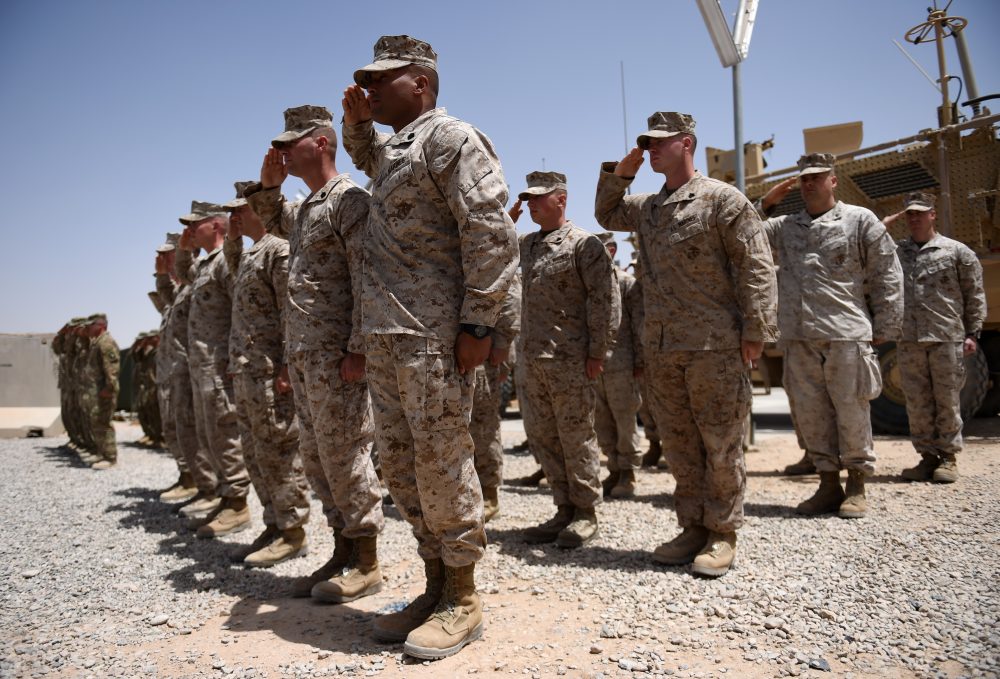 U.S. Marines salute during a handover ceremony at Leatherneck Camp in Lashkar Gah in the Afghan province of Helmand on April 29, 2017. (Wakil Koshar/AFP/Getty Images)