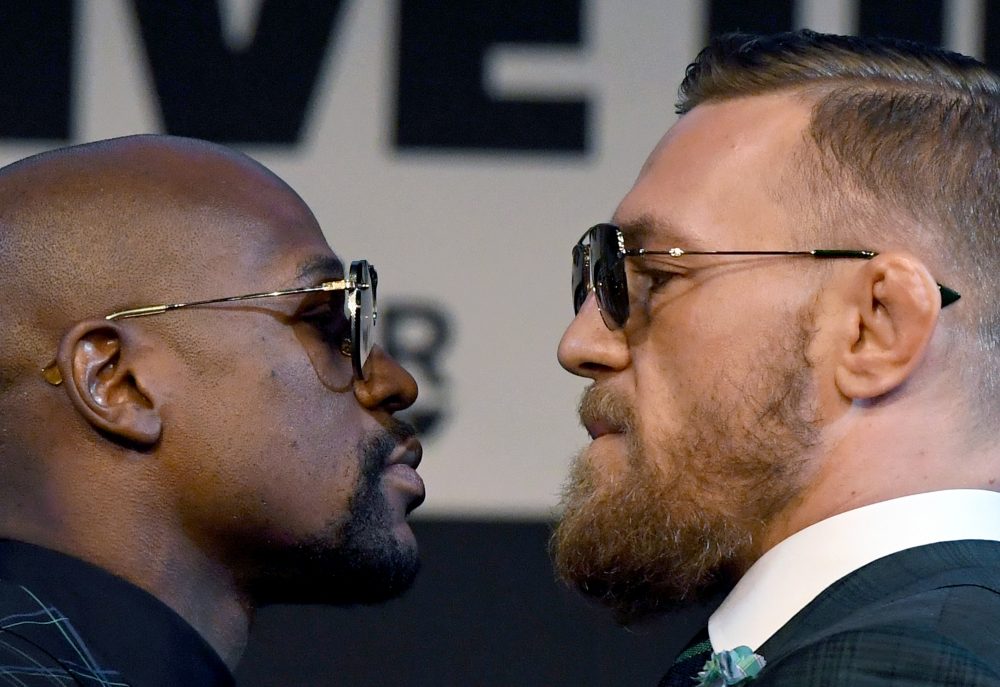 Boxer Floyd Mayweather Jr. (left) and UFC lightweight champion Conor McGregor face off during a news conference at the KA Theatre at MGM Grand Hotel & Casino on Aug. 23, 2017 in Las Vegas, Nevada. (Ethan Miller/Getty Images)