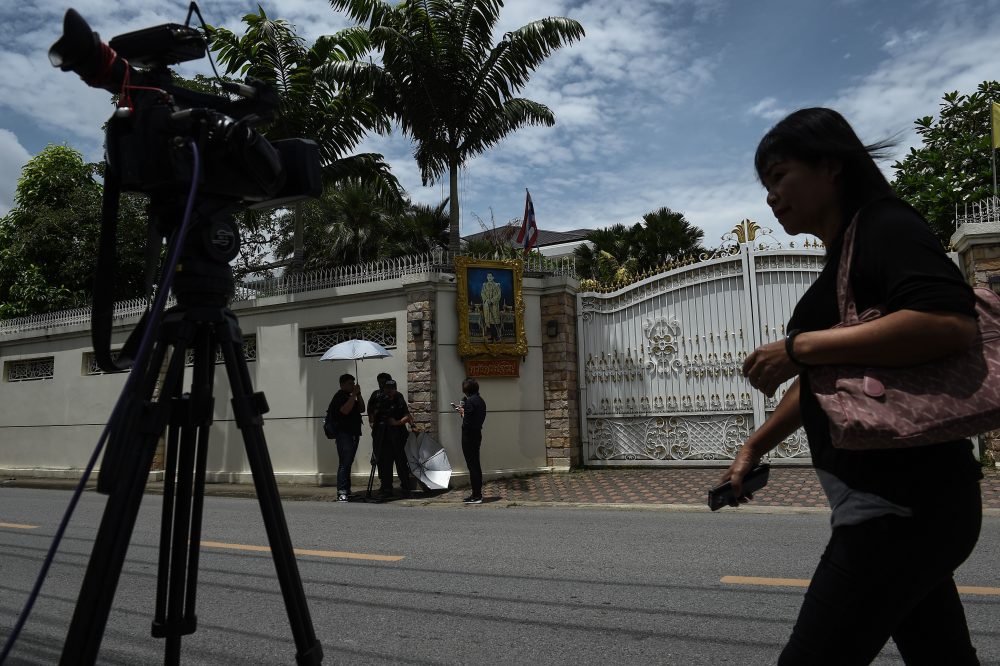 Members of the media film outside of the house of former Thai Prime Minister Yingluck Shinawatra in Bangkok on Aug 25, 2017. (Lillian Suwanrumpha/AFP/Getty Images)