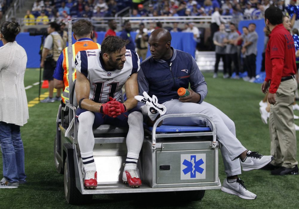Patriots wide receiver Julian Edelman is taken off the field on a cart during the first half of an NFL preseason football game against the Detroit Lions Friday in Detroit. (Duane Burleson/AP)