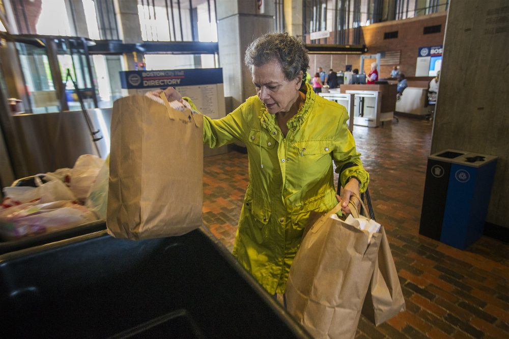 Diane Georgopoulos, of Cambridge, made a trip from home to Boston City Hall Tuesday to drop off supplies for the flood victims of Hurricane Harvey in Houston. (Jesse Costa/WBUR)