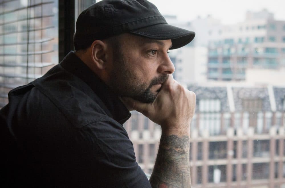 In this Jan. 9, 2017, photo, Christian Picciolini, founder of the group Life After Hate, poses for a photograph in his Chicago home. Picciolini, a former skinhead, is an activist combatting what many see as a surge in white nationalism across the United States. He's doing it by helping members quit groups including the Ku Klux Klan and skinhead organizations. (Teresa Crawford/AP)