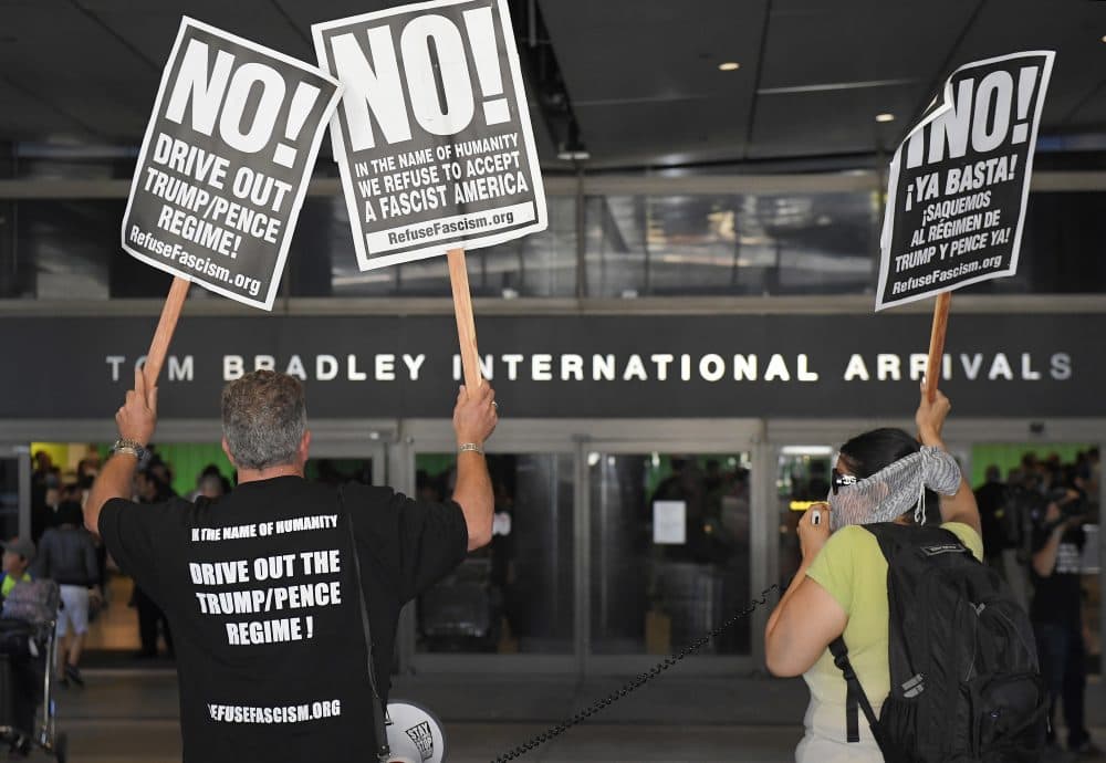 Activists protest outside the Tom Bradley International Terminal at Los Angeles International Airport, Thursday, June 29, 2017, in Los Angeles. (Mark J. Terrill/ AP)