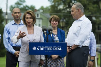 House Minority Leader Nancy Pelosi of Calif., accompanied by, from left, Rep. Hakeem Jeffries, D-N.Y., Sen. Amy Klobuchar, D-Minn. and Senate Minority Leader Chuck Schumer of N.Y. speaks in a park in Berryville, Va., Monday, July 24, 2017, where they unveiled the Democrats new agenda. (Cliff Owen/AP)