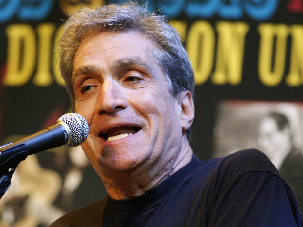 In this May 6, 2010 file photo, former U.S. poet laureate Robert Pinsky recites one of his poems on stage at Fairleigh Dickinson University in Madison, N.J. Dozens of prominent poets will be at the Boston Public Library on Thursday evening, July 27, 2017, to read aloud from the city's first anthology of poetry ,“City of Notions.&quot; Pinsky, who teaches English and creative writing at Boston University, is among nearly 60 contributors to the anthology.  (AP Photo/Mel Evans, File)