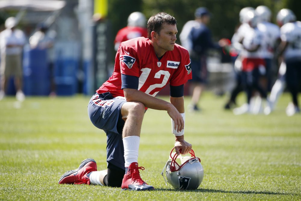 New England Patriots quarterback Tom Brady on the field during NFL football training camp. (Michael Dwyer/AP)