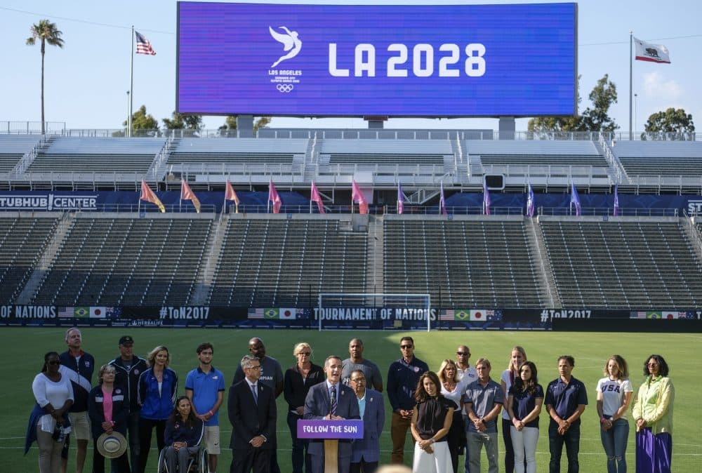 Los Angeles Mayor Eric Garcetti, center, speaks during a press conference to make an announcement for the city to host the Olympic Games and Paralympic Games 2028, at Stubhub Center in Carson, outside of Los Angeles, Calif., Monday, July 31, 2017. (AP Photo/Ringo H.W. Chiu)