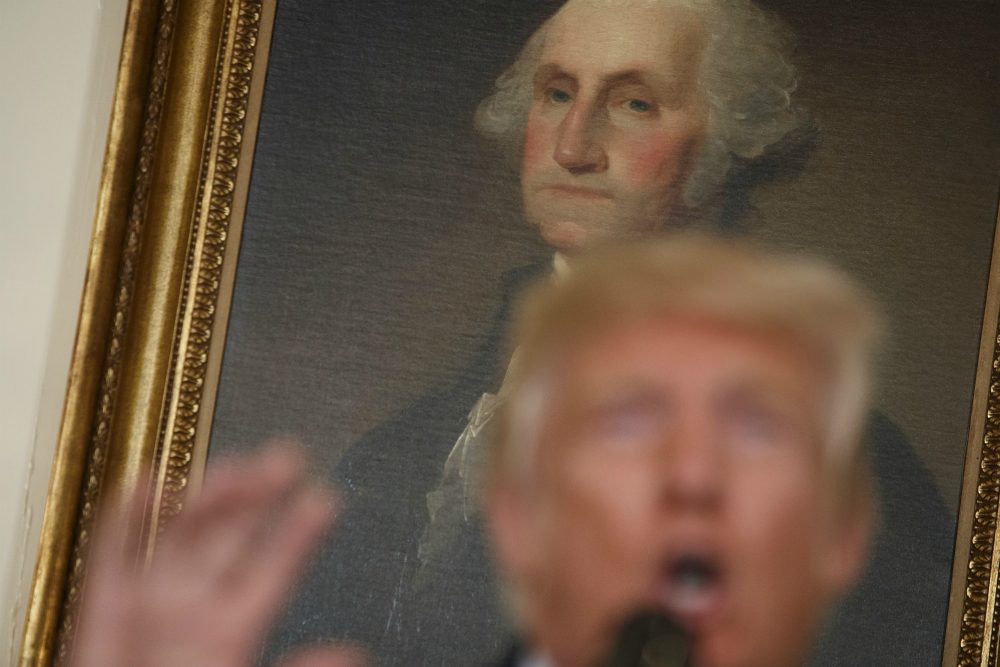 A portrait of George Washington hangs behind President Donald Trump as he speaks about the deadly white nationalist rally in Charlottesville, Va., Monday, Aug. 14, 2017, in the Diplomatic Room of the White House in Washington. (Evan Vucci/ AP)