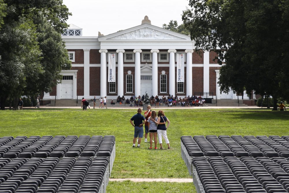 A family takes photographs during first year move-in day while on the Lawn of the University of Virginia, Friday, Aug. 18, 2017, in Charlottesville, Va., a week after a white nationalist rally took place on there. (Jacquelyn Martin/AP)