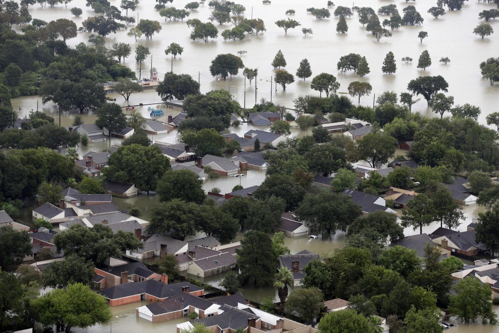 Homes are flooded near the Addicks Reservoir as floodwaters from Tropical Storm Harvey rise Tuesday in Houston. (David J. Phillip/AP)