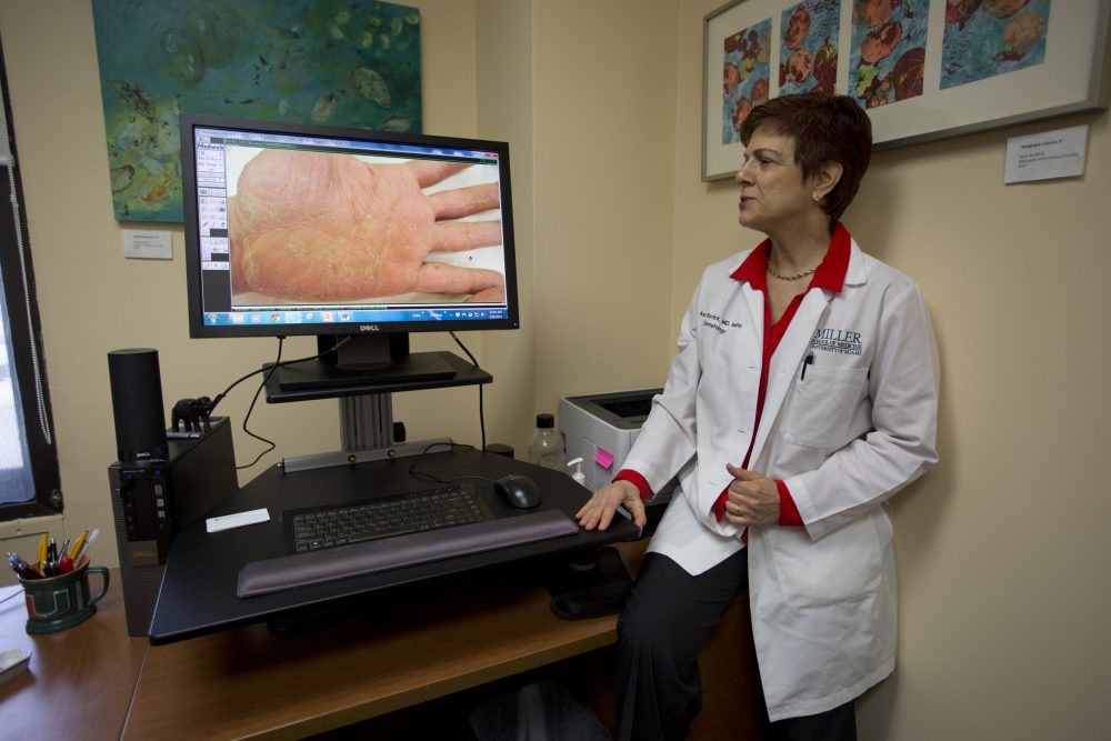 University of Miami dermatologist Dr. Anne Burdick checks the computer screen as she discusses telemedicine on April 8, 2014. (J Pat Carter/AP)