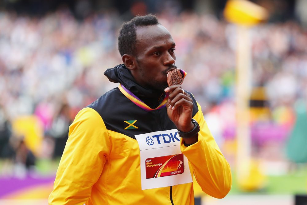 Usain Bolt of Jamaica receives the bronze medal for the men's 100-meter during day three of the IAAF World Athletics Championships in London. (Richard Heathcote/Getty Images)