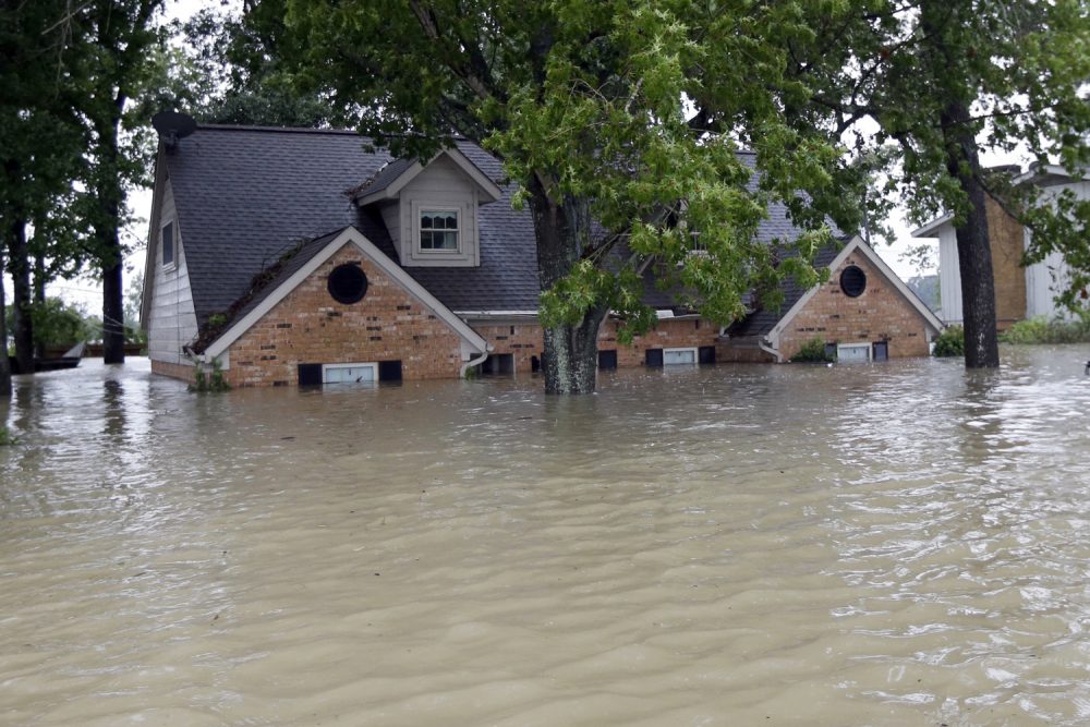 A home is surrounded by floodwaters from Tropical Storm Harvey in Spring, Texas. (David J. Phillip/AP)A home is surrounded by floodwaters from Tropical Storm Harvey in Spring, Texas. (David J. Phillip/AP)