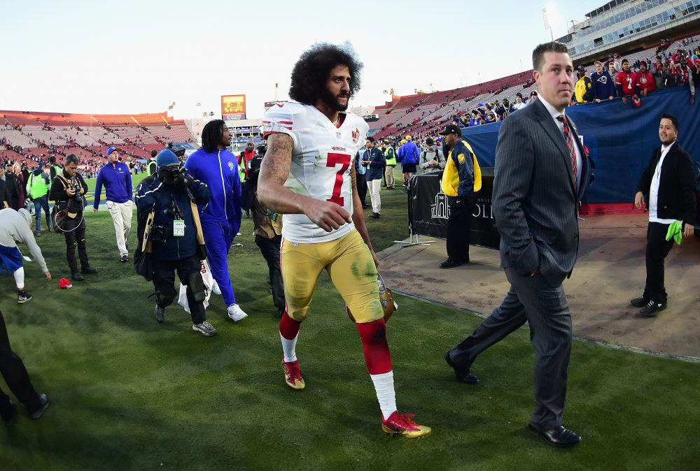 LOS ANGELES, CA -  Colin Kaepernick of the San Francisco 49ers walks off the field in December 2016. Some feel he's being ridden out of football by colluding owners who didn't like his taking a knee during the national anthem before games. (Photo by Harry How/Getty Images)