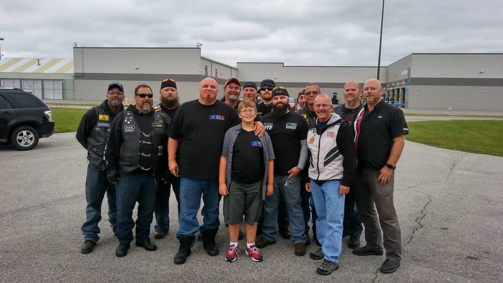 Phil Mick, center, with Brent Warfield, fourth from left, and other bikers who came to escort him to school. (Courtesy of Brent Warfield)