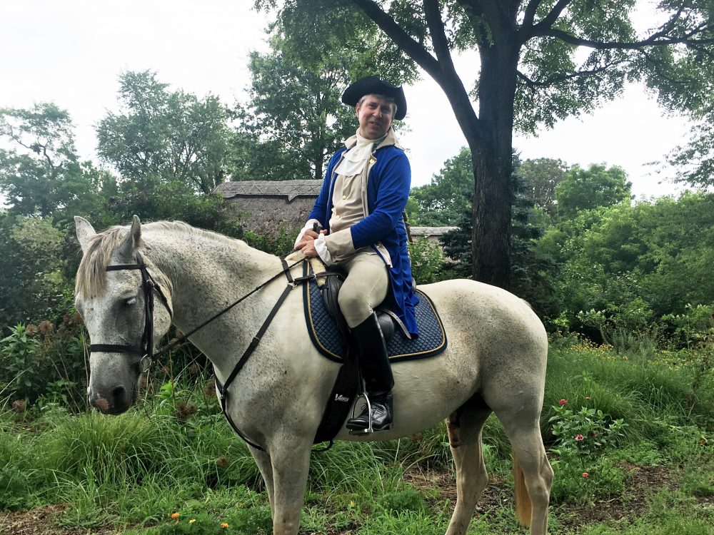 Philip Smucker, wearing colonial garb, rides along a trail in Plains, Virginia. (Shannon Venezia)