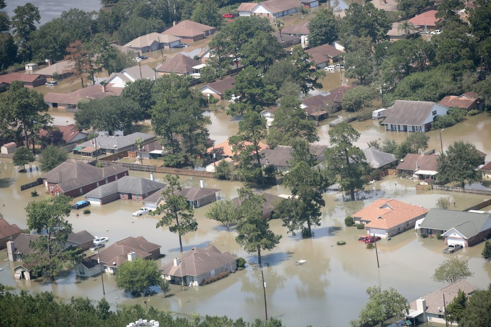 Homes are surrounded by floodwater after torrential rains pounded southeast Texas following Hurricane and Tropical Storm Harvey on Aug. 31, 2017 in Orange, Texas. (Scott Olson/Getty Images)