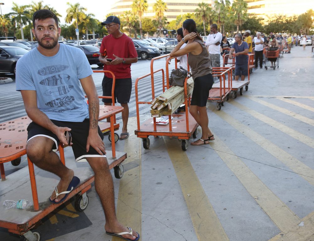 Max Garcia, of Miami, waits in a line since dawn to purchase plywood sheets at The Home Depot store in North Miami, Fla., Wednesday, Sept. 6, 2017. Florida residents are preparing for the possible landfall of Hurricane Irma, the most powerful Atlantic Ocean hurricane in recorded history. (Marta Lavandier/AP)