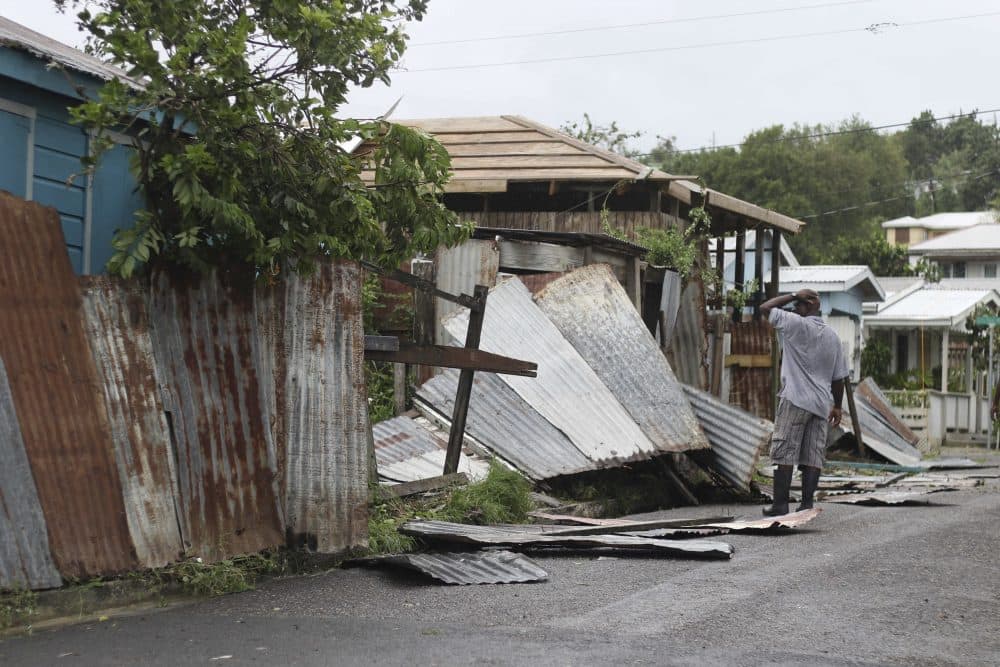 A man surveys the wreckage on his property after the passing of Hurricane Irma, in St. John's, Antigua and Barbuda, Wednesday, Sept. 6, 2017. Heavy rain and 185-mph winds lashed the Virgin Islands and Puerto Rico's northeast coast as Irma, the strongest Atlantic Ocean hurricane ever measured, roared through Caribbean islands on its way to a possible hit on South Florida. (Johnny Jno-Baptiste/AP)