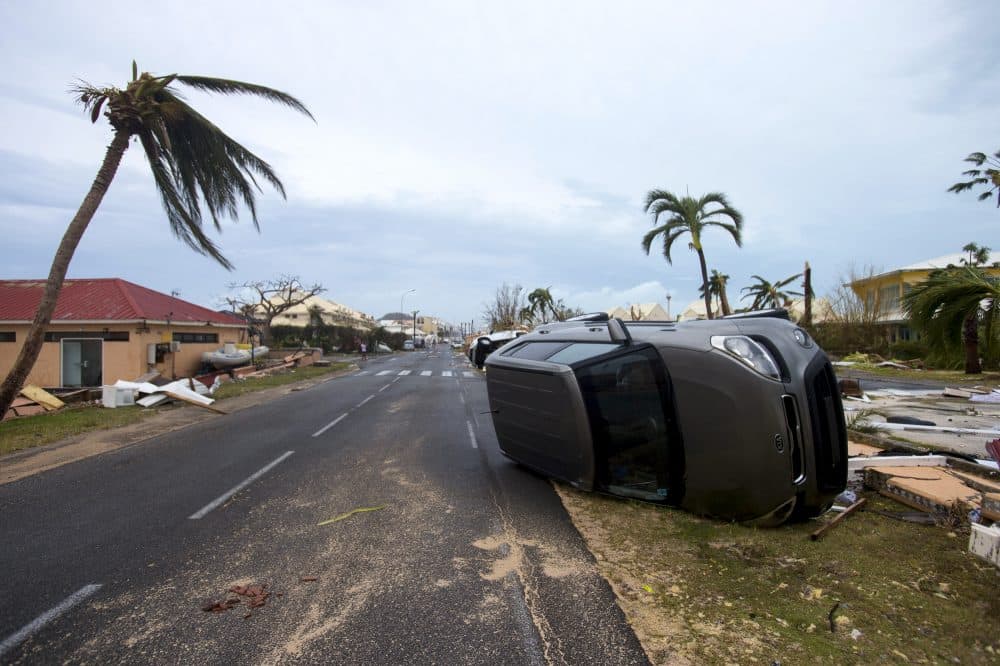 A photo taken on Sept. 6, 2017, shows a car turned onto its side in Marigot, near the Bay of Nettle, on the French Collectivity of Saint Martin after the passage of Hurricane Irma. (Lionel Chamoiseau/AFP/Getty Images)