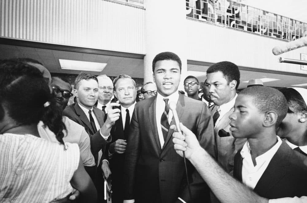 Muhammad Ali speaks to the press in 1967 after a jury found him guilty of refusing to be inducted. (Ed Kolenovsky/AP)