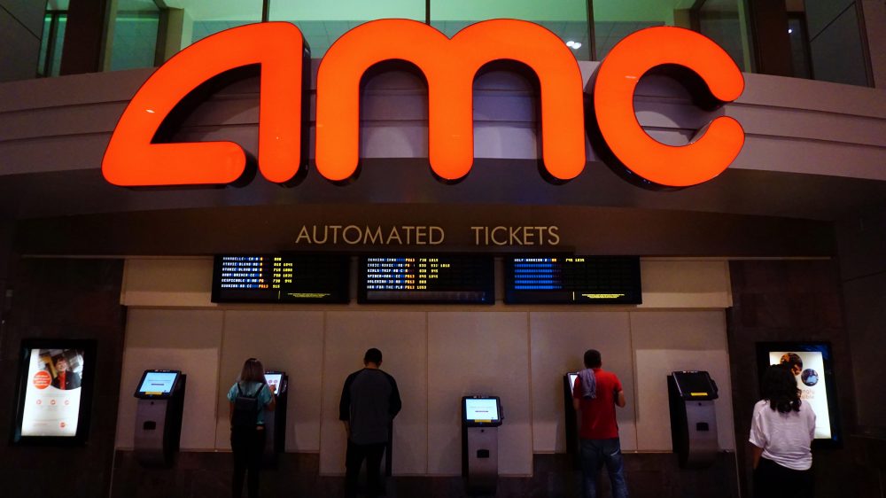 Moviegoers purchase automated tickets at an AMC movie theater in Arcadia, Calif., on Aug. 2, 2017. AMC Entertainment Holdings, the world's largest movie theater owner, announced a &quot;shocking&quot; expectation for secod-quarter losses, with stocks diving by 25 percent amid a weak box office. (Frederic J. Brown/AFP/Getty Images)