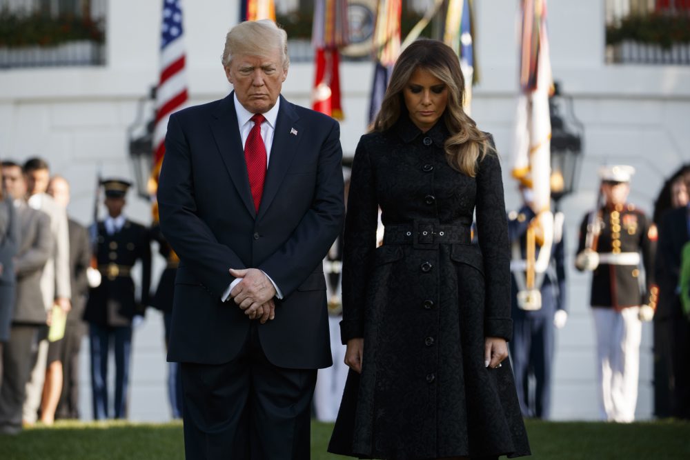 President Donald Trump and first lady Melania Trump stand for a moment of silence to mark the anniversary of the Sept. 11 terrorist attacks, on the South Lawn of the White House, Monday, Sept. 11, 2017, in Washington. (Evan Vucci/AP)