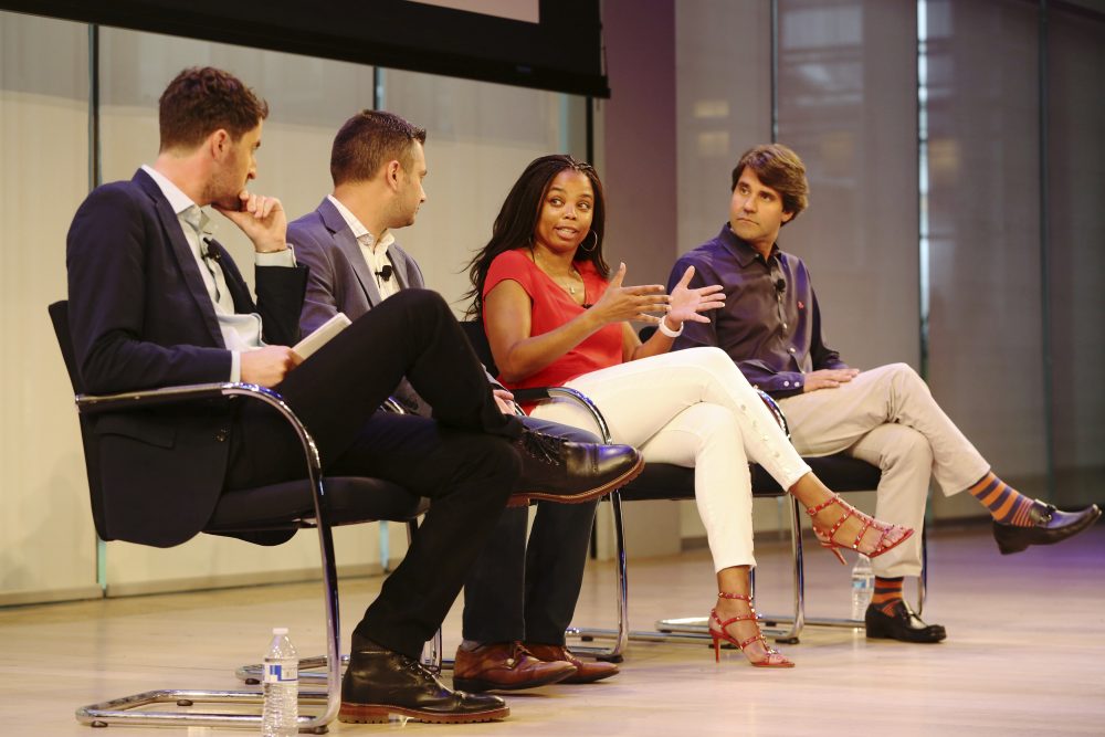 Jemele Hill, anchor on ESPN's SportsCenter, speaks on stage with Michael Shiffman, Nate Ravitz, and Daniel Roberts at a 2017 sports conference. (Steve Luciano/AP Images)