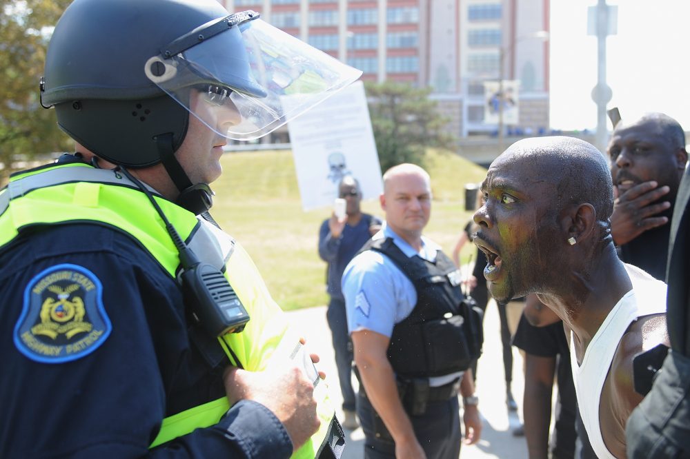 A man yells at a law enforcement officer during a protest action following a not guilty verdict on September 15, 2017 in St. Louis, Mo. Protests erupted following the acquittal of former St. Louis police officer Jason Stockley, who was charged with first-degree murder last year in the shooting death of motorist Anthony Lamar Smith in 2011. (Michael B. Thomas/Getty Images)