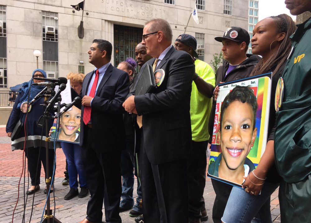 The family of Kyzr Willis stands with lawyers during a press conference in September 2017. The family announced they have settled a lawsuit with the city of Boston in the little boy's death. (Steve Brown/WBUR)
