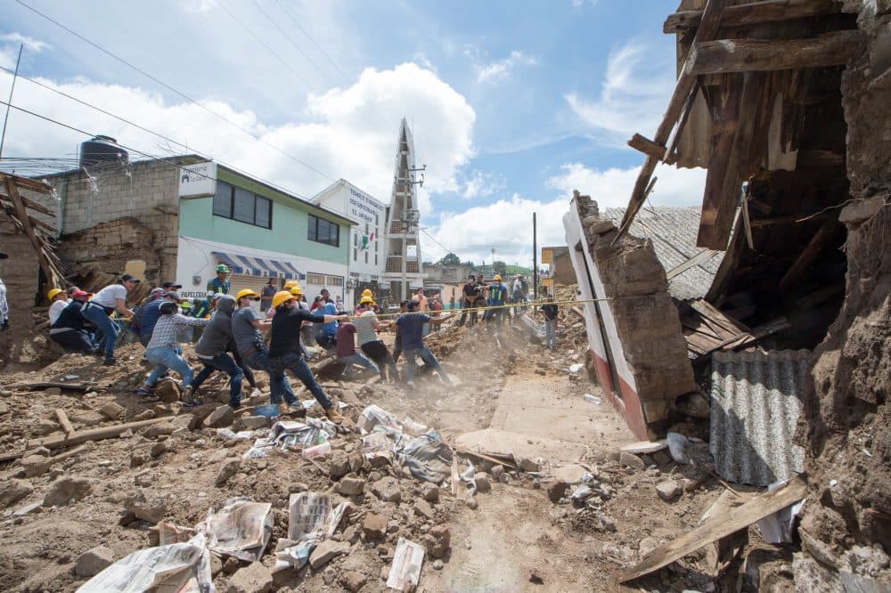 Soldiers and volunteers knock down the walls of a damaged house in Joquicingo, Mexico, on Sept. 21, 2017. Time pressed on Mexico on Thursday as rescuers looking for survivors picked through the rubble of buildings felled by a powerful earthquake two days earlier, with hopes fading as the hours rolled by. (Mario Vazquez/AFP/Getty Images)