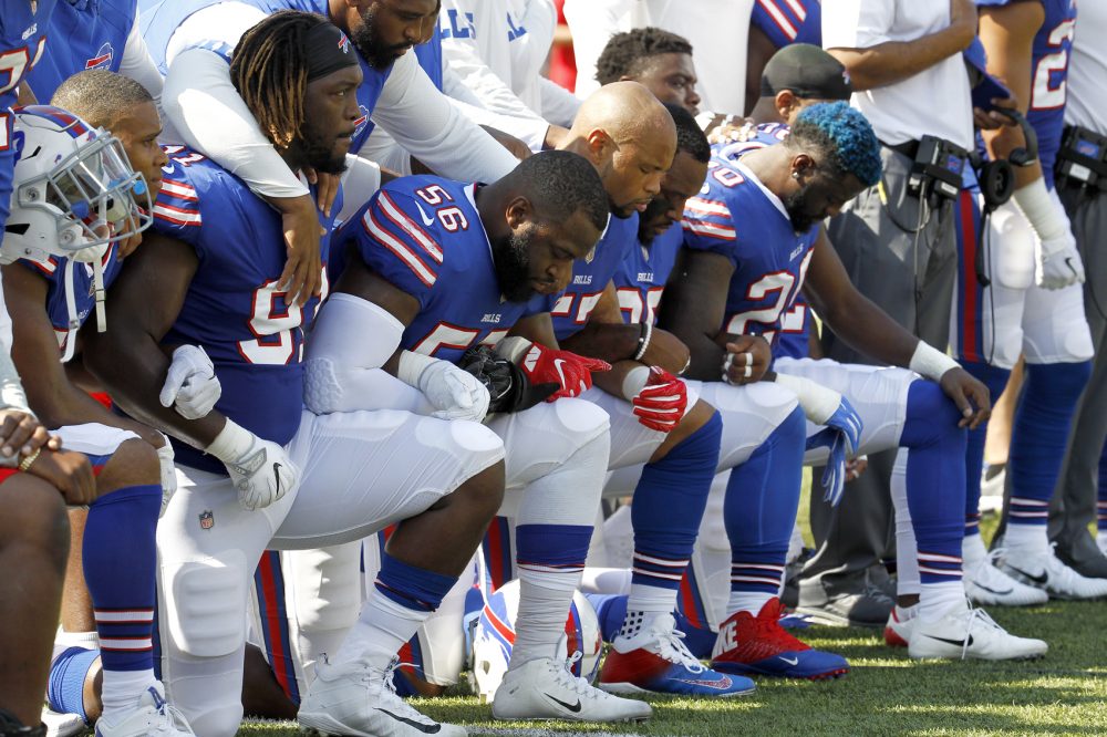 Buffalo Bills players kneel during the national anthem prior to an NFL football game against the Denver Broncos, Sunday, Sept. 24, 2017, in Orchard Park, N.Y. (Jeffrey T. Barnes/AP)