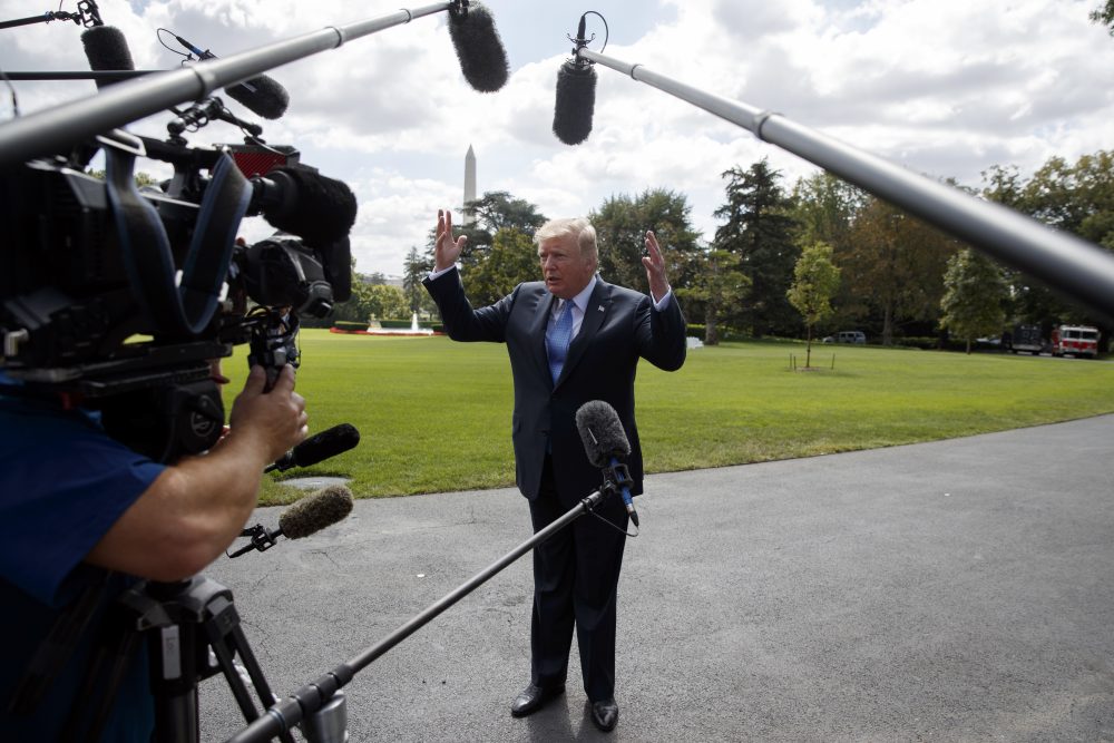 President Trump talks to reporters as he walks to board Marine One on the South Lawn of the White House, Wednesday, Sept. 27, 2017, in Washington. (Evan Vucci/AP)