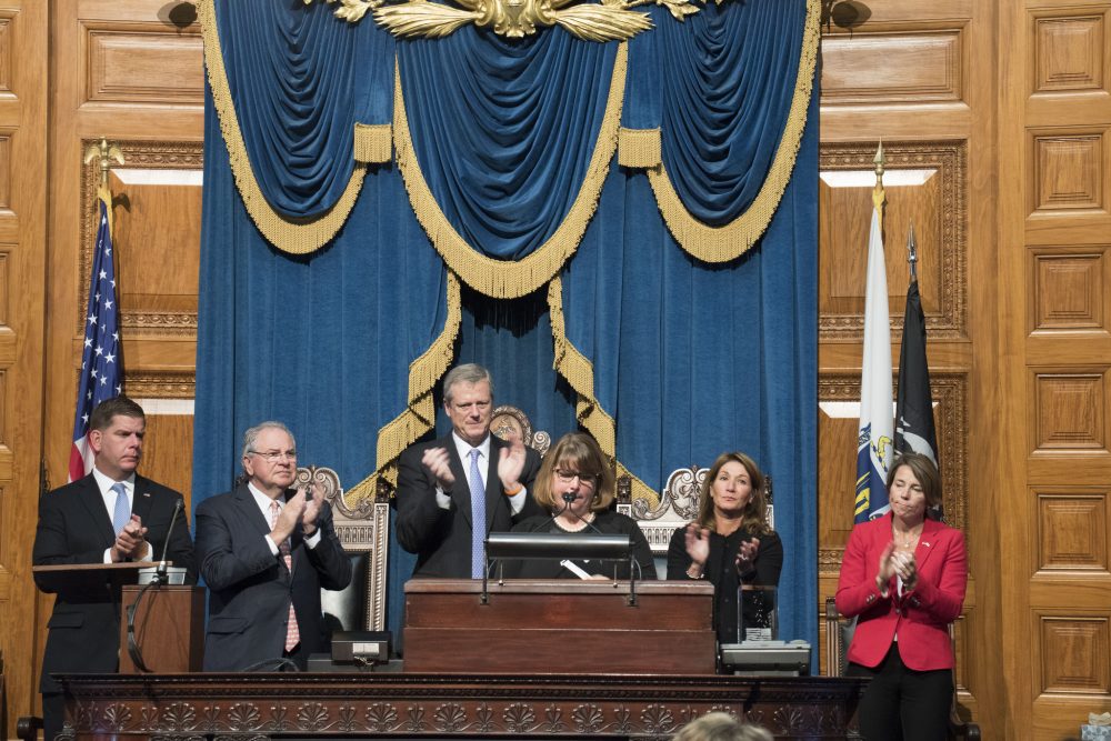 Michelle Dancy accepts the Madeline Amy Sweeney Award for Civilian Bravery on behalf of her late son, at the State House on Monday. (Courtesy of Kristina McComb for the Office of the Governor)