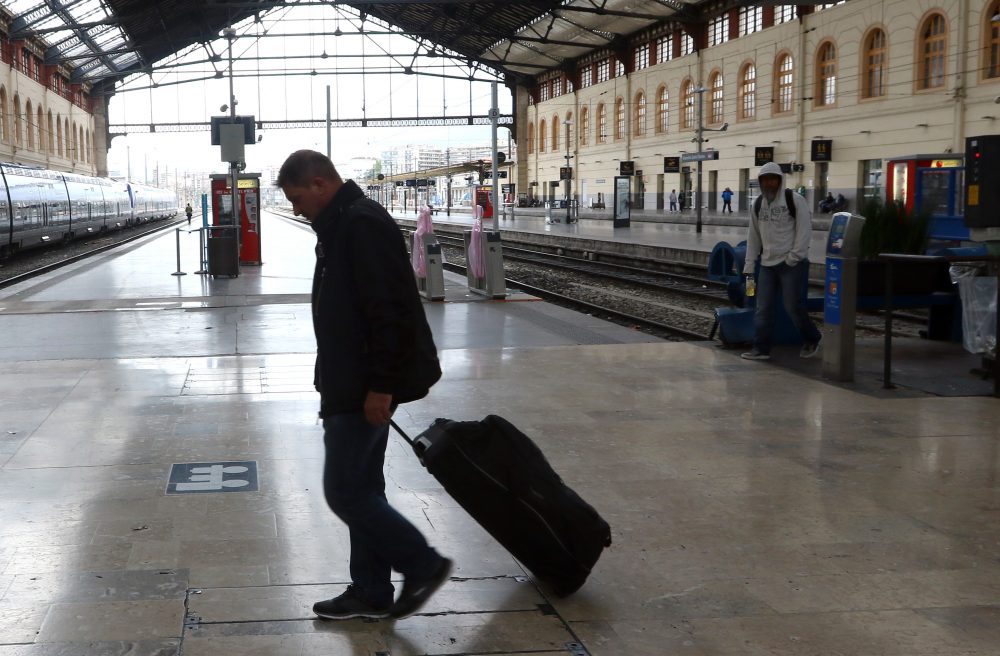 A passenger walks past an empty platform at the Saint Charles train station, in Marseille. (Claude Paris/AP File Photo)