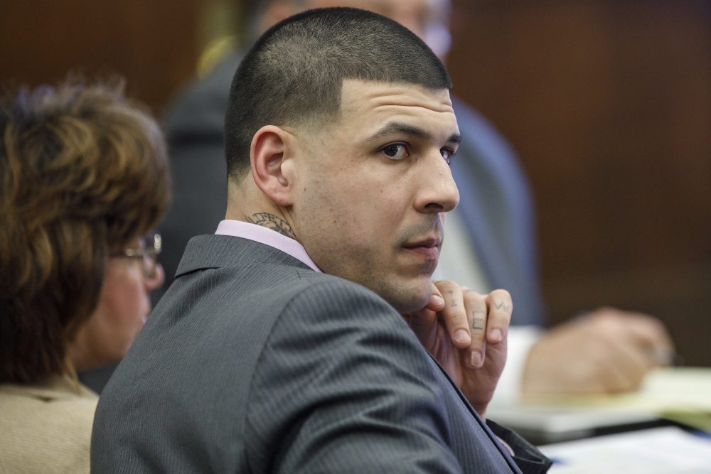 Aaron Hernandez sits in court. (Pat Greenhouse/The Boston Globe via AP, Pool)