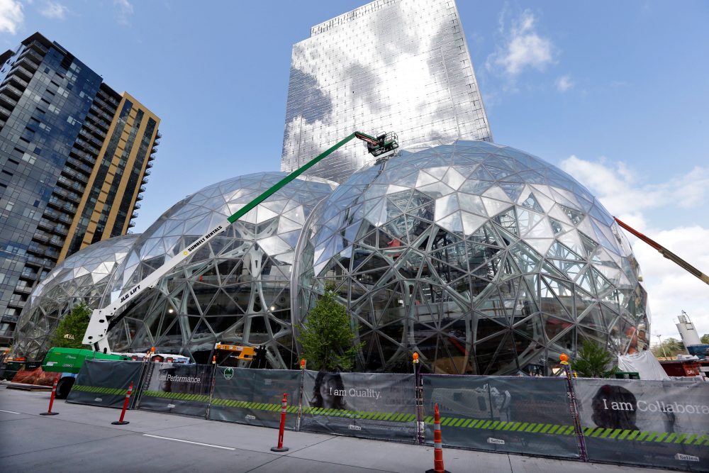 In this April 27 file photo, construction continues on three large domes as part of an expansion of the Amazon campus in downtown Seattle. Amazon said Thursday that it will spend more than $5 billion to build another headquarters in North America to house as many as 50,000 employees. (Elaine Thompson/AP)