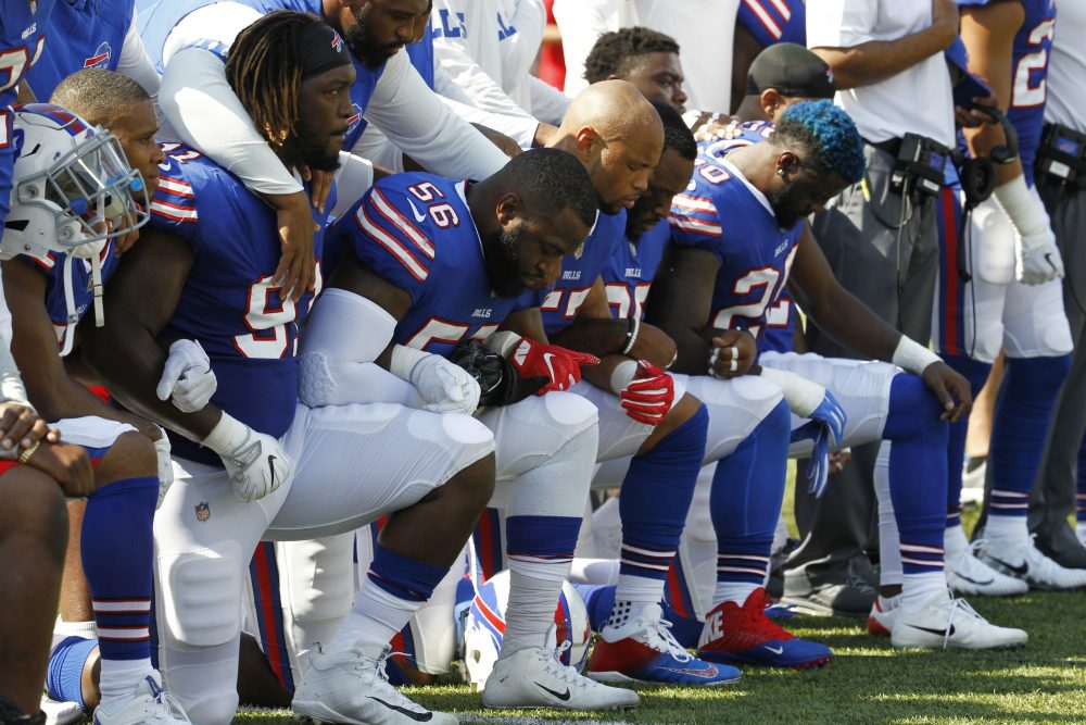 Buffalo Bills players take a knee during the national anthem prior to an NFL football game against the Denver Broncos, Sunday, Sept. 24, 2017, in Orchard Park, N.Y. (Jeffrey T. Barnes/AP)