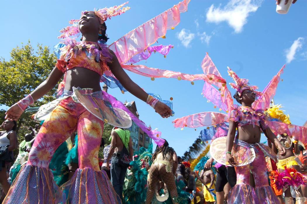 The Cambridge Carnival, with participants like these from 2013, returns this weekend. (Greg Cook/WBUR)